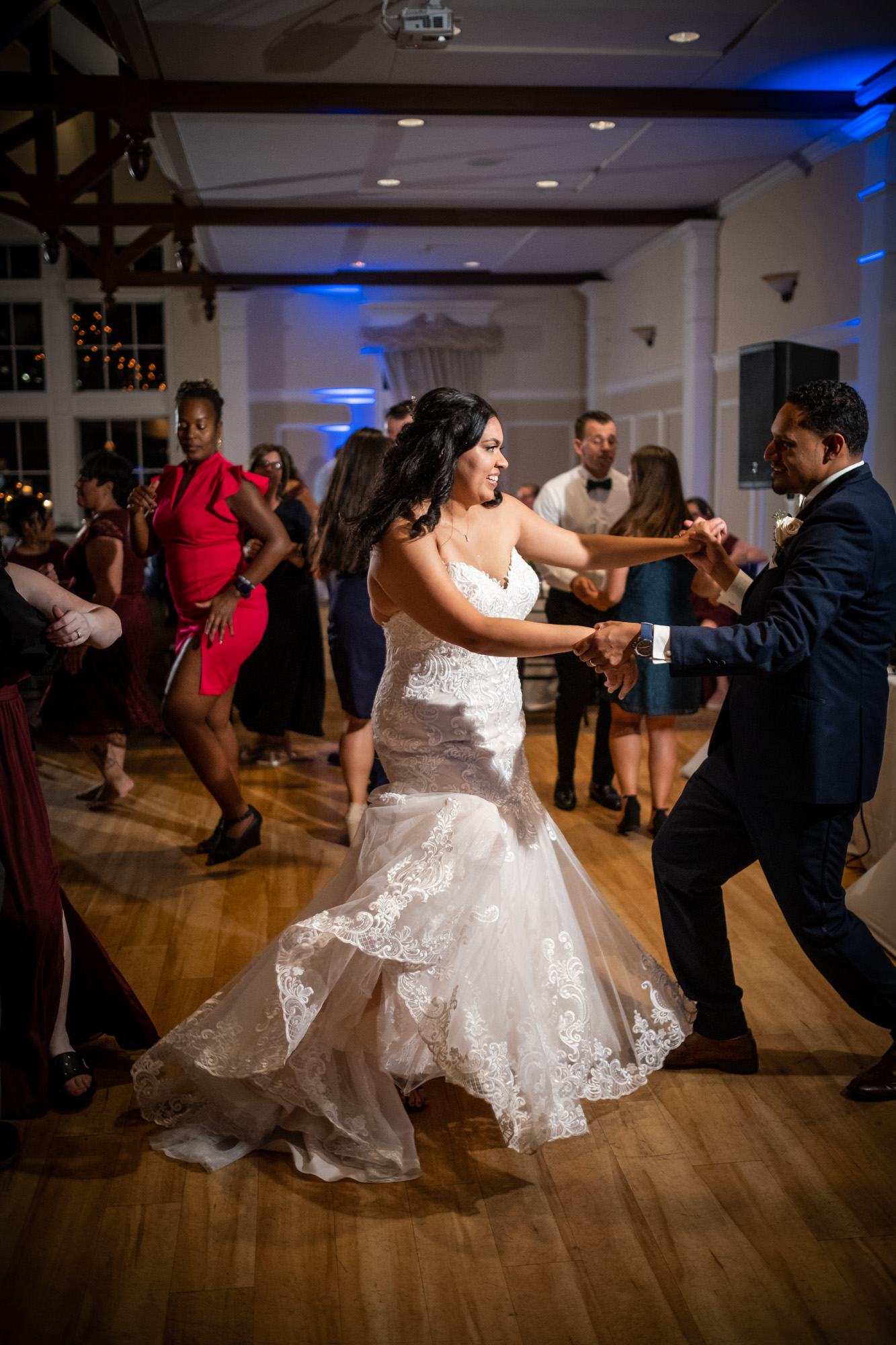 bride and groom dancing at mansion at bald hill reception with blue uplighting