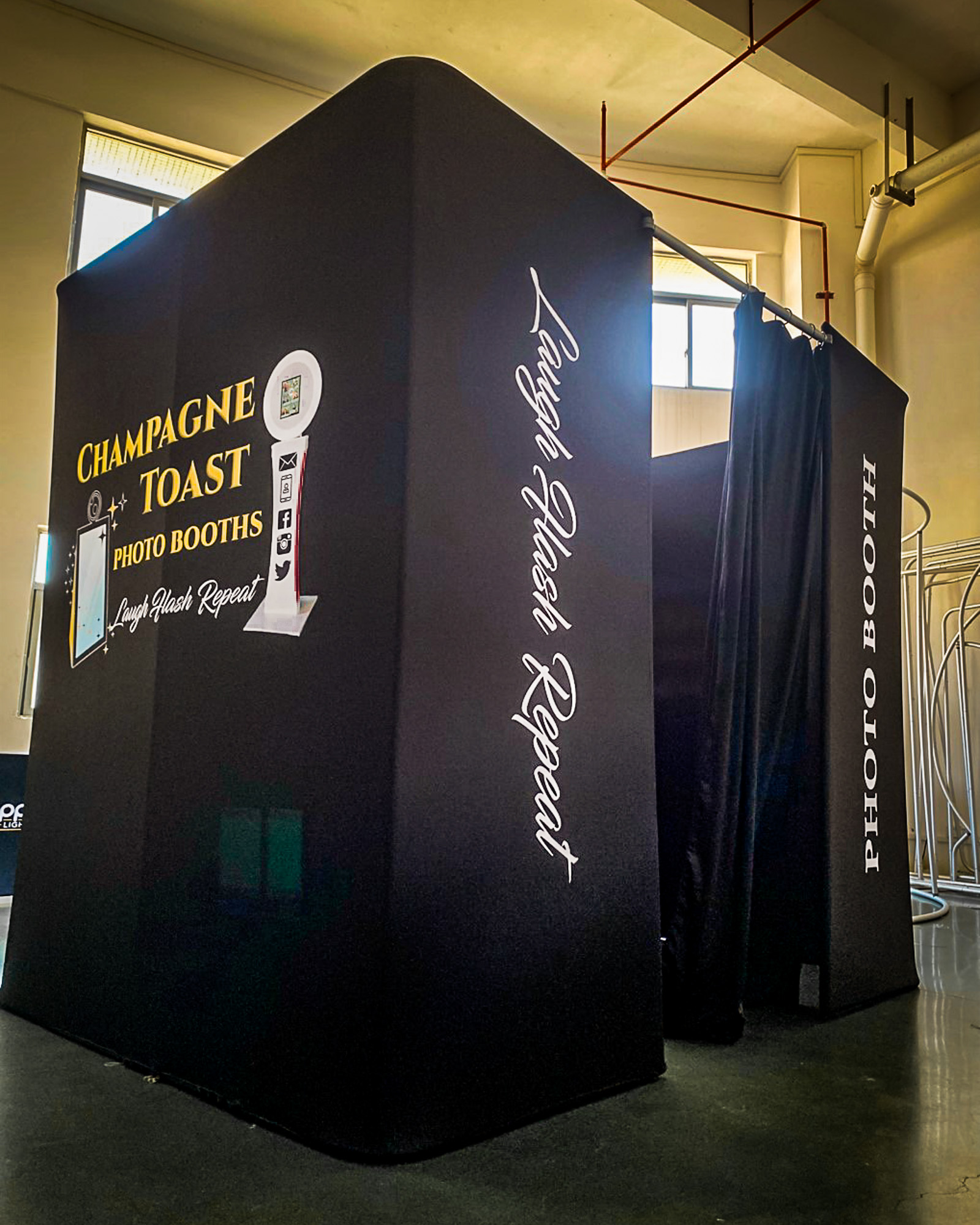 black enclosed photo booth for champagne toast djs